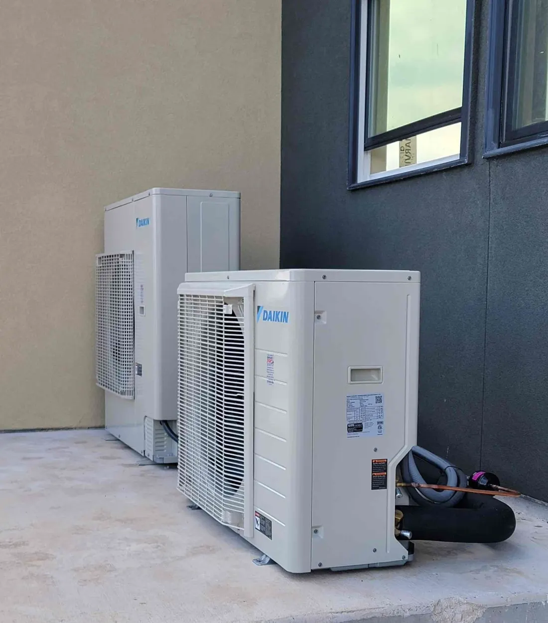 Two Daikin outdoor units installed by ReliaBee at a San Antonio home